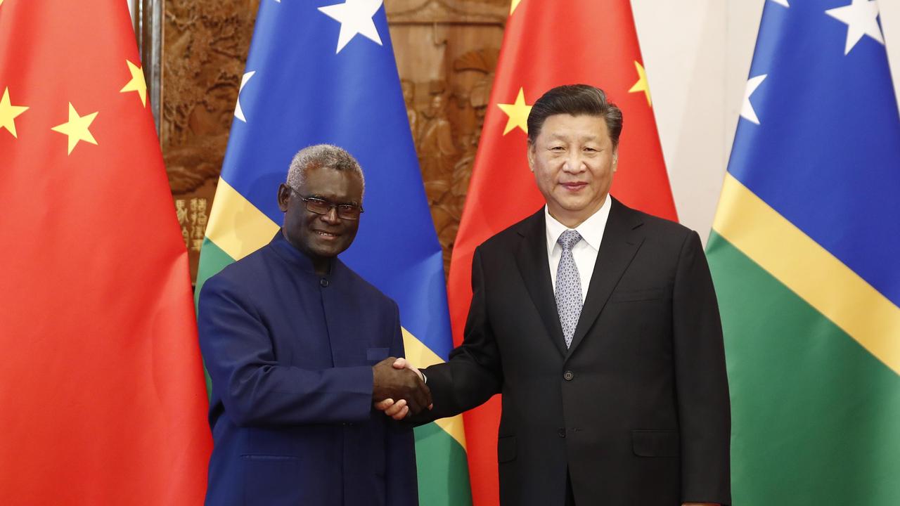 Chinese President Xi Jinping shakes hands with Prime Minister Manasseh Damukana Sogavare of the Solomon Islands in 2019. Picture: Sheng Jiapeng/China News Service/VCG via Getty Images.