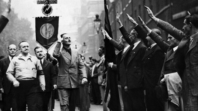 Head of the British Union of Fascists, Oswald Mosley (centre), takes the fascist salute from members in 1937.