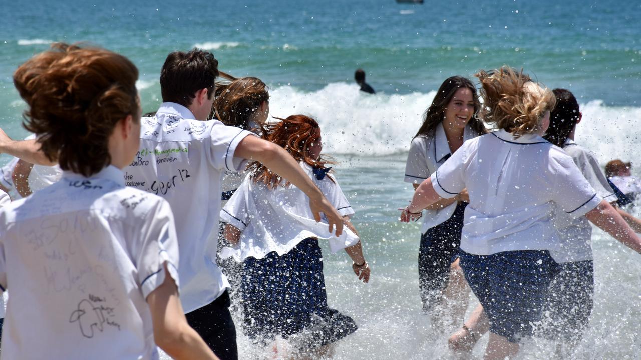 Year 12 graduates from schools across the Sunshine Coast hit to the water at Mooloolaba Beach to celebrate the end of their schooling. Photo: Mark Furler