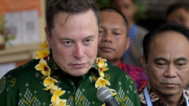 Mr Musk (L) speaks during a ceremony held to inaugurate satellite unit Starlink. Picture: SONNY TUMBELAKA / AFP