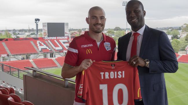 Adelaide United recruit James Troisi with Reds director of football Bruce Djite. Picture: Adelaide United