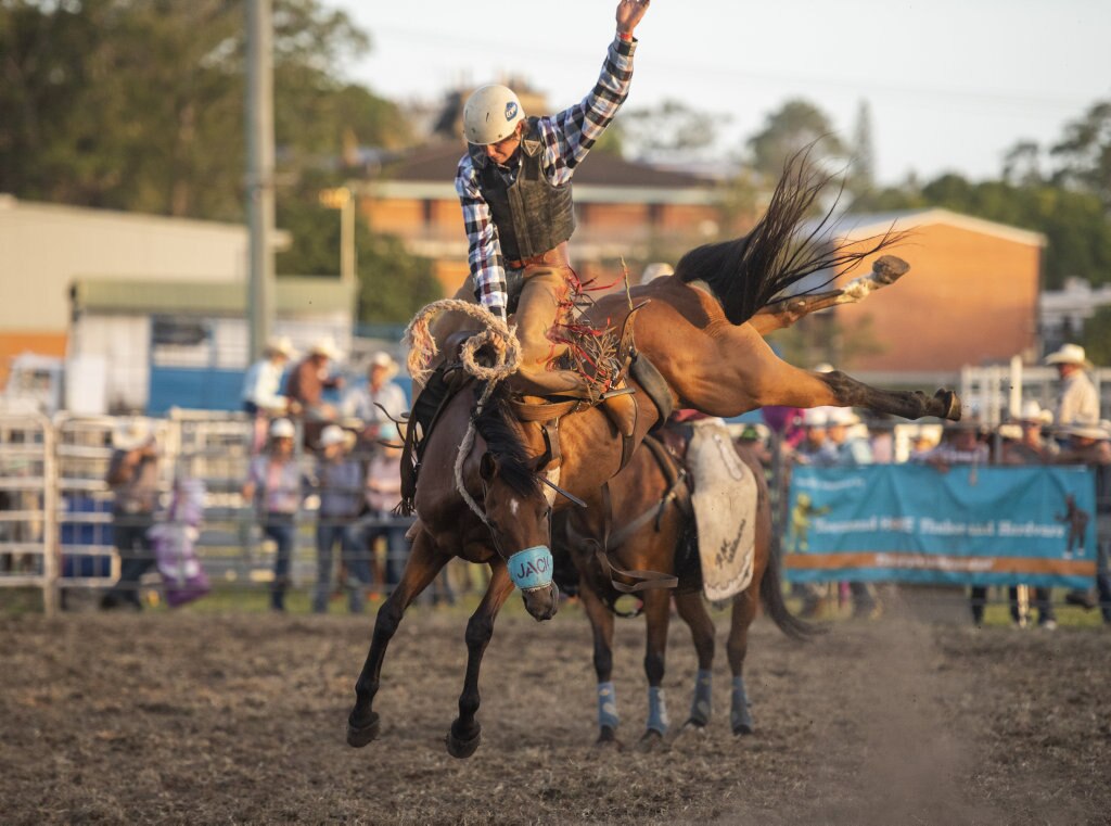 Jack Pittman gets some air in the saddle bronc at the Lawrence Twilight Rodeo. Picture: Adam Hourigan