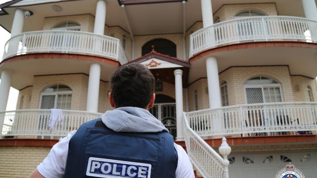 Border agents and police prepare to raid this western Sydney mansion. Picture: NSW Police