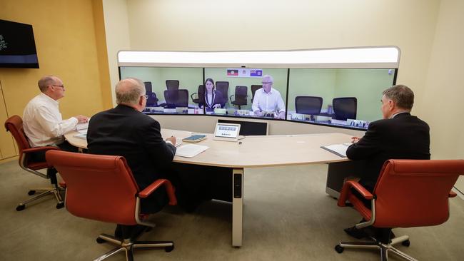 Secretary of the Department of Prime Minister and Cabinet Phil Gaetjens, PM Scott Morrison and Chief Medical Officer Professor Brendan Murphy speak NSW Premier Gladys Berejiklian during a national cabinet meeting. Picture: Alex Ellinghausen