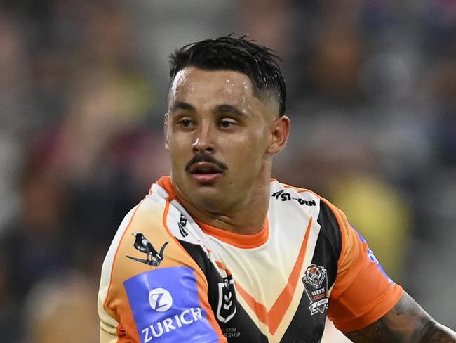 TOWNSVILLE, AUSTRALIA - MAY 24: Jayden Sullivan of the Tigers runs the ball during the round 12 NRL match between North Queensland Cowboys and Wests Tigers at Qld Country Bank Stadium, on May 24, 2024, in Townsville, Australia. (Photo by Ian Hitchcock/Getty Images)