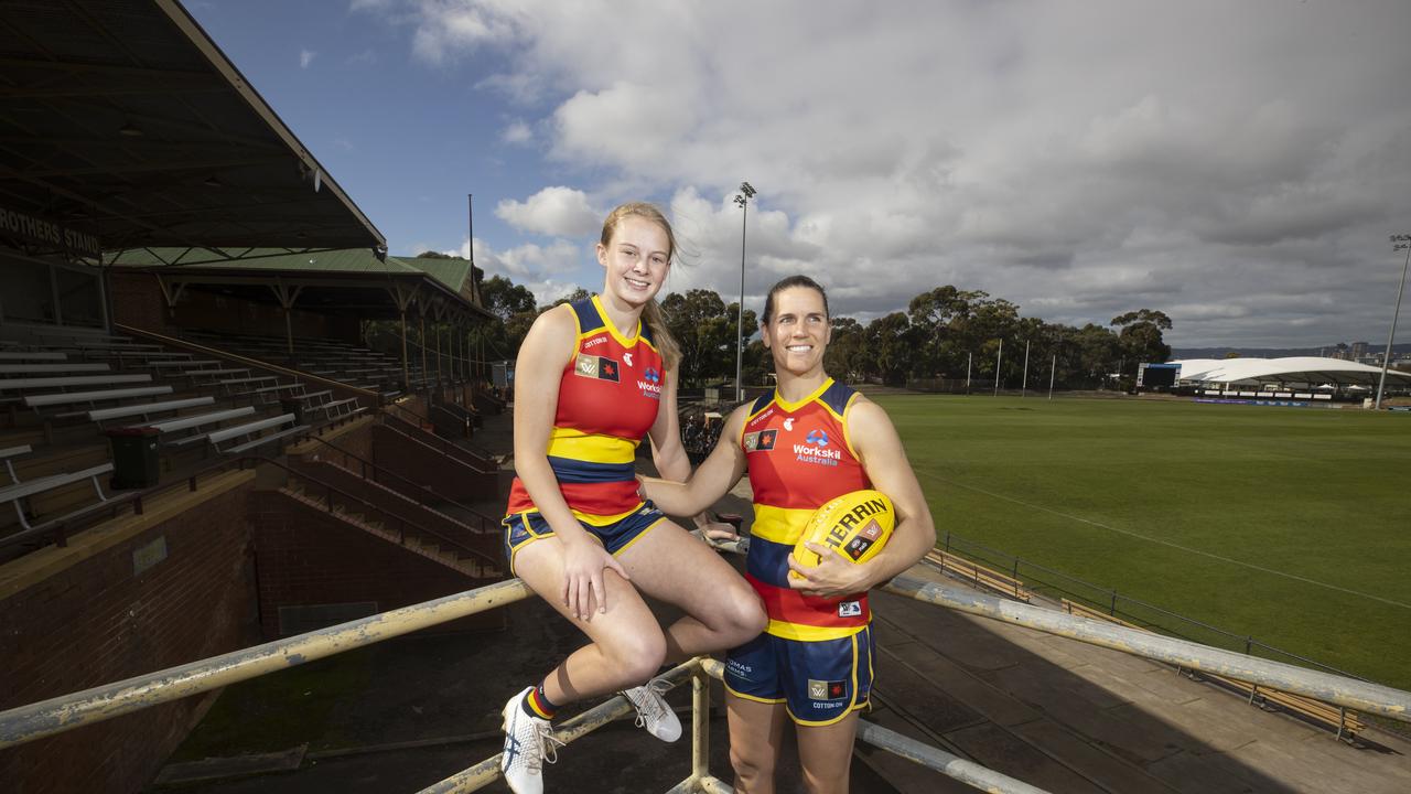 Adelaide Crows player Brooke Tonon with her captain Chelsea Randall at the Crows new headquarters at Thebarton Oval, 24 August 2022. Picture: Simon Cross