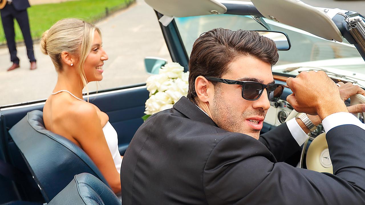 Melbourne star Christian Petracca and his wife Bella leave the Royal Botanical Gardens after getting married on Friday afternoon. Picture: Ian Currie