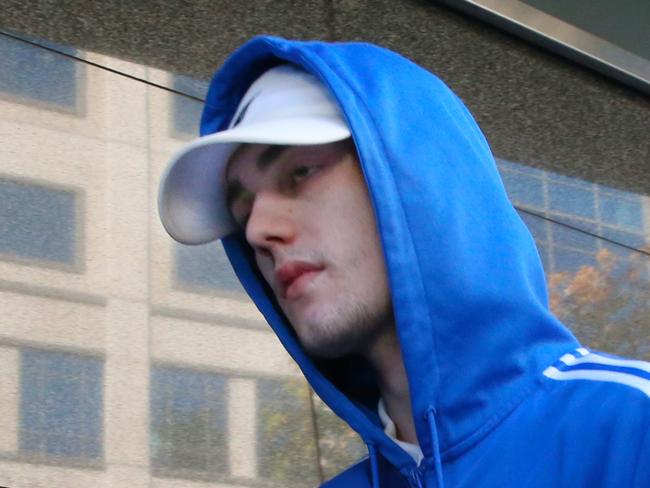 Isiah Stephens who bashed a top transport cop last year leaves the County court in Melbourne. Monday, May 18, 2020. Picture: David Crosling