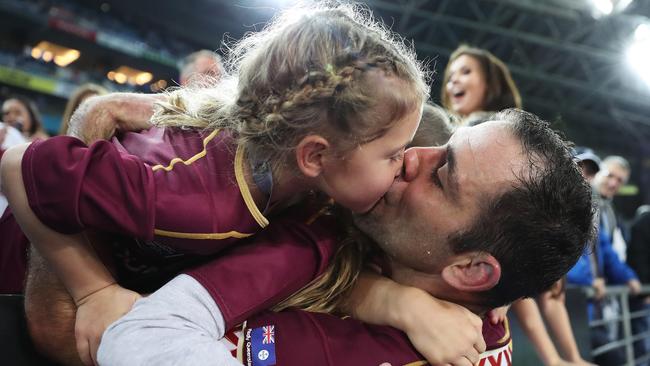 Cameron Smith celebrates with his daughter after a State of Origin victory in Sydney. Picture: Brett Costello