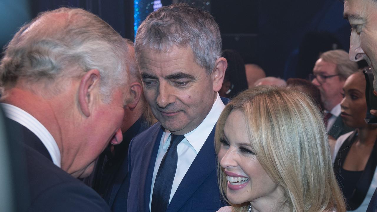 Prince Charles meets cast members Rowan Atkinson and Kylie Minogue after attending a one off performance of 'We Are Most Amused and Amazed' in celebration of his 70th birthday. Picture: Getty