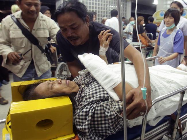 An injured woman is brought through a hospital after a bombing in the southern Thai province of Pattani on October 24, 2016. One person was killed and 18 others were wounded, some of them critically, when a bomb exploded outside a noodle shop in Thailand's far south, police and witnesses said October 24. The attack coincided with the anniversary of the death of dozens of local Muslims at the hands of Thai security forces, an event that kicked off the current insurgency more than a decade ago. / AFP PHOTO / TUWAEDANIYA MERINGING