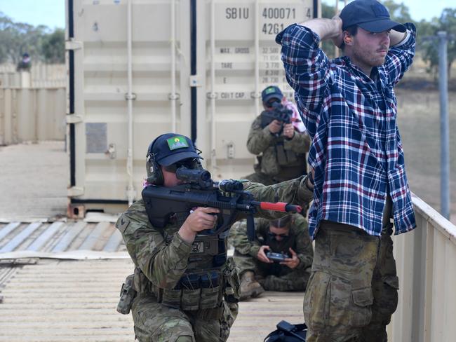 US Marines in conjunction with Australian soldiers from Battle Group Eagle comprising of elements of 3rd Brigade conduct an urban clearance of a fictitious invading force at the Townsville Filed Training Area. Defenders from an invading fictitious force at the Urban Operations Training Facility. Picture: Evan Morgan