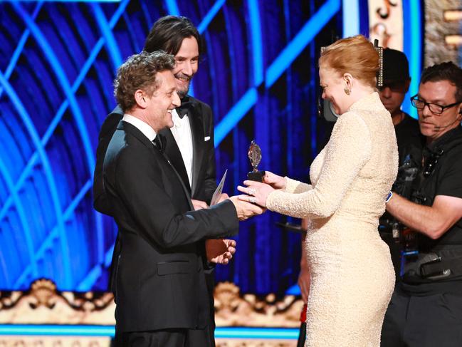 Sarah Snook accepts the Best Performance by an Actress in a Leading Role in a Play award from actors Alex Winter and Keanu Reeves. Picture: Getty Images