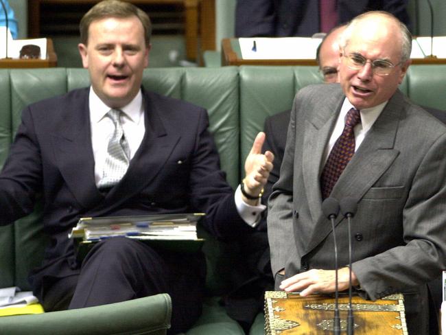 Aust politician Prime Minister John Howard (r) with Peter Costello during Question Time at the House of Representatives in Parliament 30 Nov 2000.