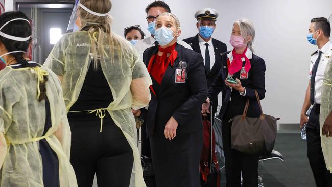 Qantas crew and travellers from Sydney have their permits checked in the Qantas terminal. Picture: Ian Currie