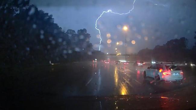 Dashcam footage captures lightning on the Eastern Freeway in Melbourne. Picture David Caird