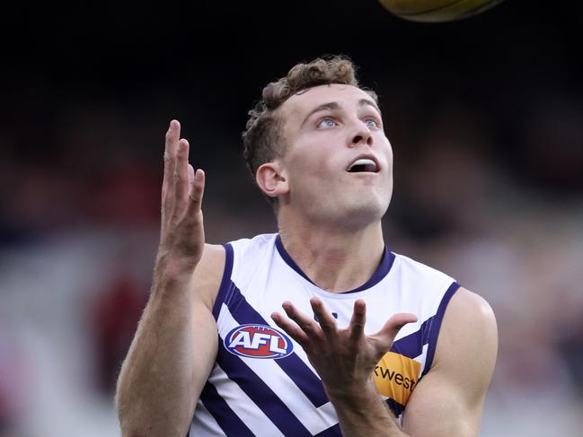 MELBOURNE, AUSTRALIA - AUGUST 04: Tom Emmett of the Dockers marks the ball during the round 21 AFL match between Essendon Bombers and Fremantle Dockers at Melbourne Cricket Ground, on August 04, 2024, in Melbourne, Australia. (Photo by Martin Keep/AFL Photos/via Getty Images)