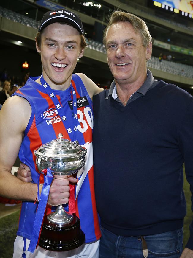 Darcy Moore with his famous father Peter after Sunday’s win.