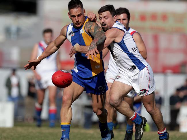 Liam Brandt and Luke Lirosi vie for possession during the NFL Division 1 decider.