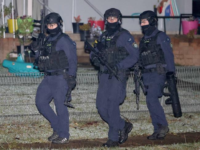 Riot police pictured in Whalan during a police operation. Picture: Damian Shaw