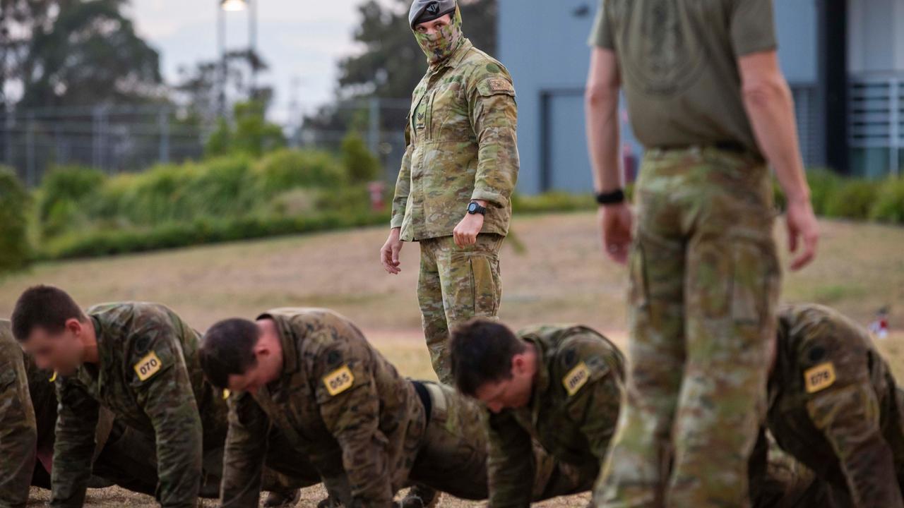 An RAAF combat controller (centre) from the ADF School of Special Operations supervises Commando Selection Course candidates. Picture: