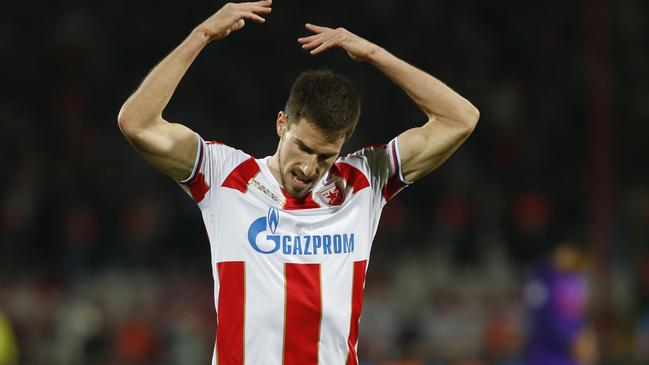 Red Star's Milos Degenek gestures as he asks for support from his fans during the Champions League group C soccer match between Red Star and Liverpool at the Rajko Mitic stadium in Belgrade, Serbia, Tuesday, Nov. 6, 2018. (AP Photo/Marko Drobnjakovic)