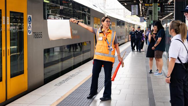 Commuters board the few running trains from Central station as many platforms remain closed as industrial action continues. Picture: Tom Parrish