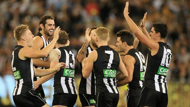 Brodie Grundy is mobbed by teammates after kicking the winning goal against Richmond. Picture: Wayne Ludbey