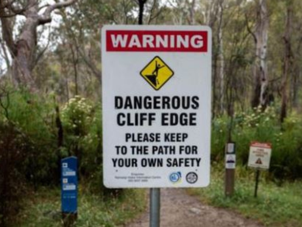 Signage at the location warns visitors off a ‘dangerous cliff edge’. Picture: ACT Parks and Conservation Service