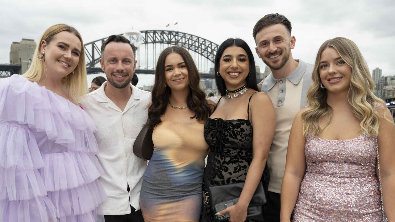 (From left to right) Tegan Ayling, Tom Woodward, Ellie Welsh, Manisha Pannu-Weston Joe Weston and Rosie Woodward prepare to ring in 2024 at the Sydney Opera House. Picture: NCA NewsWire / Monique Harmer