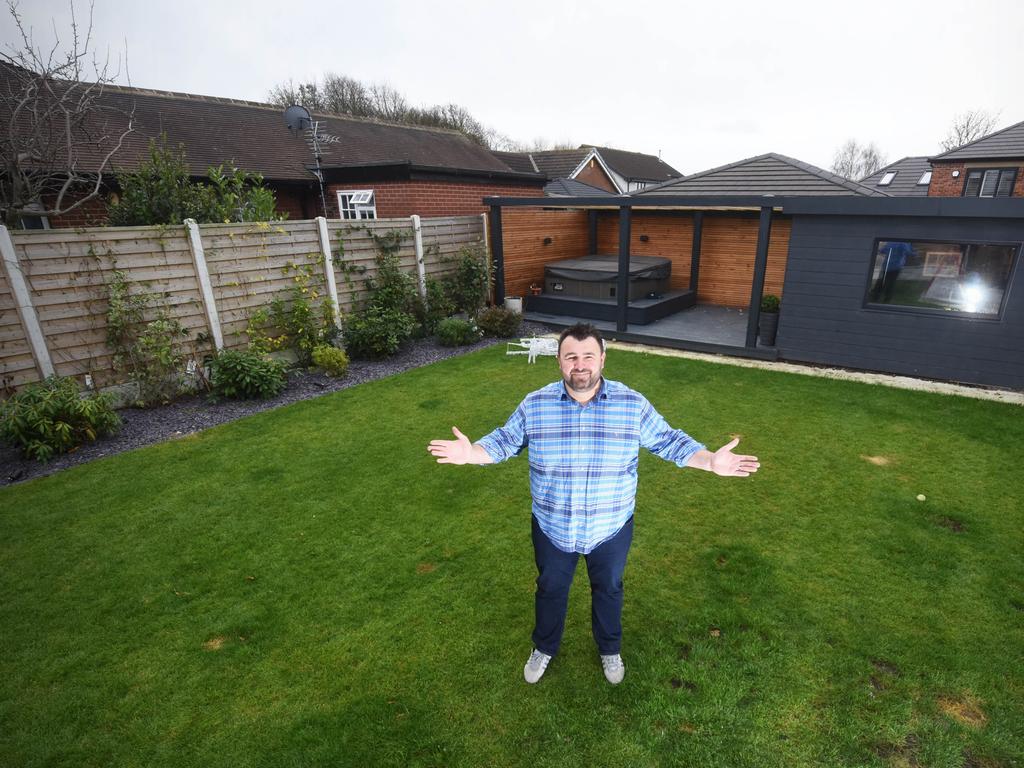 WILLIAM LAILEY / CATERS NEWS (PICTURED- Jody Wainright, 41, stood in his back garden in Wakefield, West Yorks) - A dad has spent ÃÂ£20,000 on creating a secret bunker bar in his back garden. Jody Wainright, 41, from Wakefield, West Yorks, says his family love the stylish underground bar just as much as he does - although his wife isn't such as a huge fan of the amount of time he spends down there watching football. The dad-of-two and his family were completing their self-build home when he decided he wanted to build an underground bar using the leftover materials. Jody says that he decided on an underground bar to save space in the garden and because it's something he hasn't seen before.  - SEE CATERS COPY