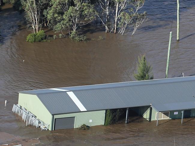 Flood damage from the air as a result of the low pressure system that hammered Sydney and the East Coast over the weekend. Flood waters outside Camden. Picture: Toby Zerna