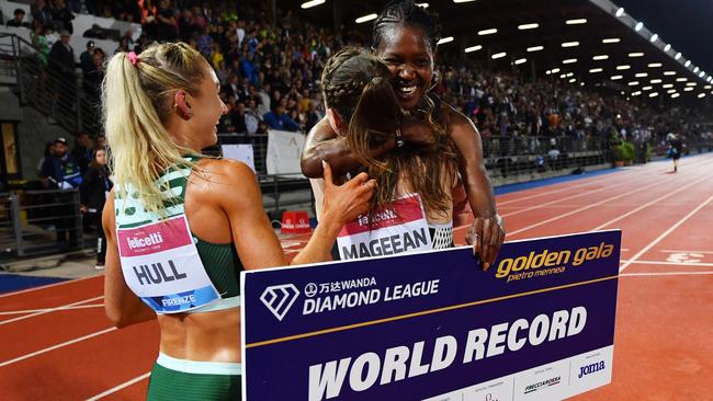 FLORENCE, ITALY - JUNE 02: Faith Kipyegon of Team Kenya interacts with Jessica Hull of Team Australia and Ciara Mageean of Team Ireland after victory in the Women's 1500m during the Golden Gala Pietro Mennea, part of the Diamond League series at Rodolfi Stadium on June 02, 2023 in Florence, Italy. (Photo by Valerio Pennicino/Getty Images)