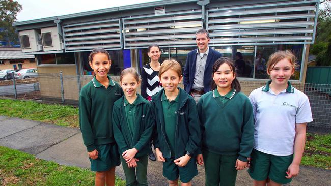 P&amp;C members and students stand outside one of the demountables. Picture: Phil Rogers