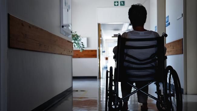 BAD AGED CARE:   Rearview shot of a senior woman sitting in a wheelchair