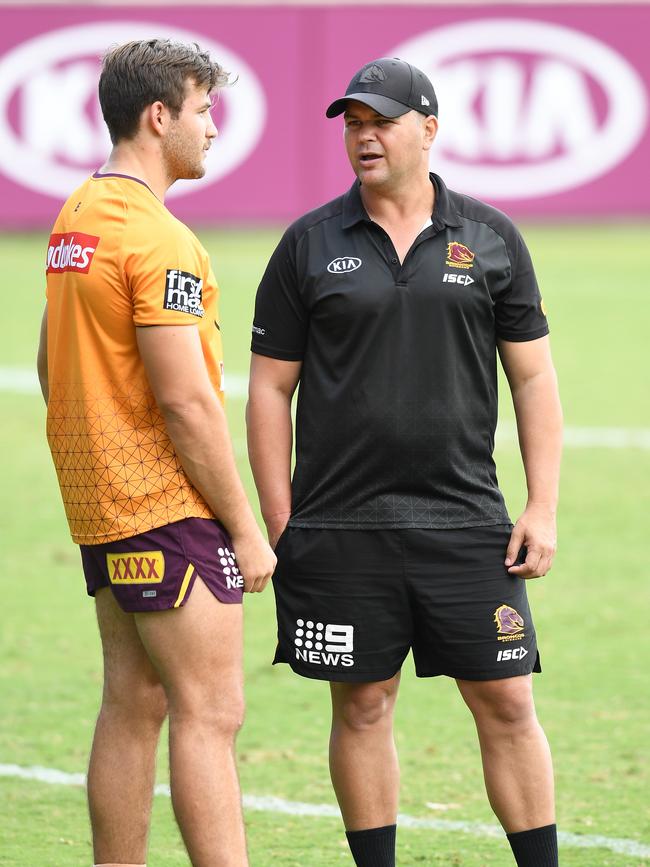 Seibold chats to Pat Carrigan during a Broncos training session.