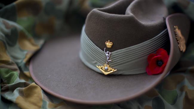 Australian Army slouch hat with red poppy.