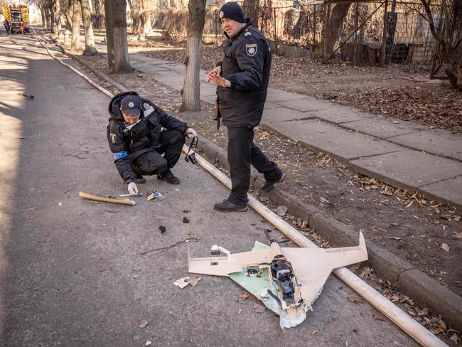 Ukrainian police officers inspect a downed Russian drone in the area of a research institute, part of Ukraine's National Academy of Science, after a strike in northwestern Kyiv. Picture: AFP