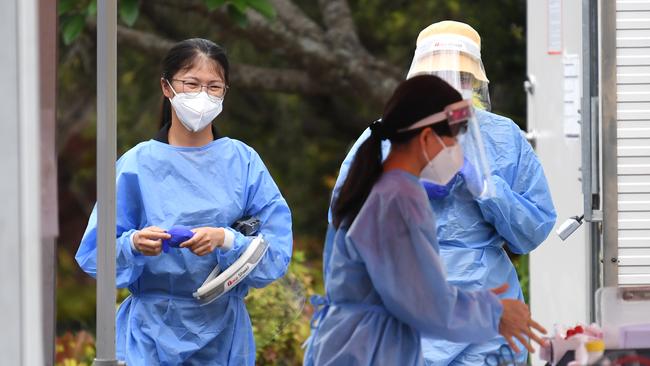 Health workers at a pop up COVID-19 testing clinic in Brisbane in November. Picture: NCA NewsWire / Dan Peled