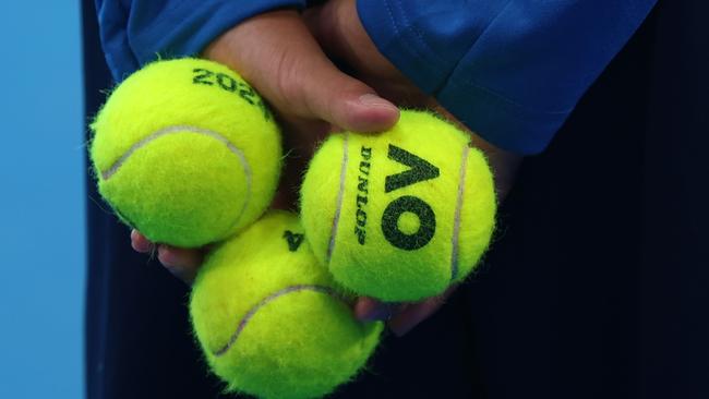 PERTH, AUSTRALIA - DECEMBER 30: A ballboy holds tennis balls in the Men's singles match between Zhang Zhizhen of China and JiÃâ¢ÃÂ­ LeheÃÂka of the Czech Republic during day two of the 2024 United Cup at RAC Arena on December 30, 2023 in Perth, Australia. (Photo by Will Russell/Getty Images)