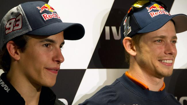 Casey Stoner (right) said the absence of Marc Marquez (left) has left the competition with a leader to set the standards.