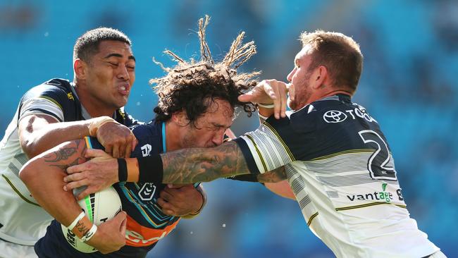 Kevin Proctor of the Titans is tackled during the round 13 NRL match between the Gold Coast Titans and the North Queensland Cowboys. (Photo by Chris Hyde/Getty Images)