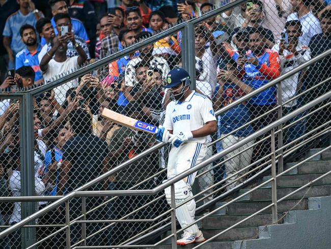 Rohit Sharma walks out to bat during the third Test against New Zealand at the Wankhede Stadium in Mumbai. Photo: AFP