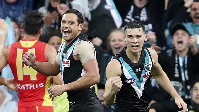 Port Adelaide’s Connor Rozee, right, celebrates a goal with Steven Motlop. Picture: SARAH REED