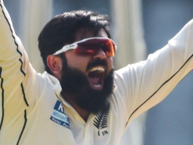 New Zealand's Ajaz Patel celebrates after dismissing India's captain Virat Kohli (not pictured) during the first day of the second Test cricket match between India and New Zealand at the Wankhede Stadium in Mumbai on December 3, 2021. (Photo by Punit PARANJPE / AFP) / IMAGE RESTRICTED TO EDITORIAL USE - STRICTLY NO COMMERCIAL USE