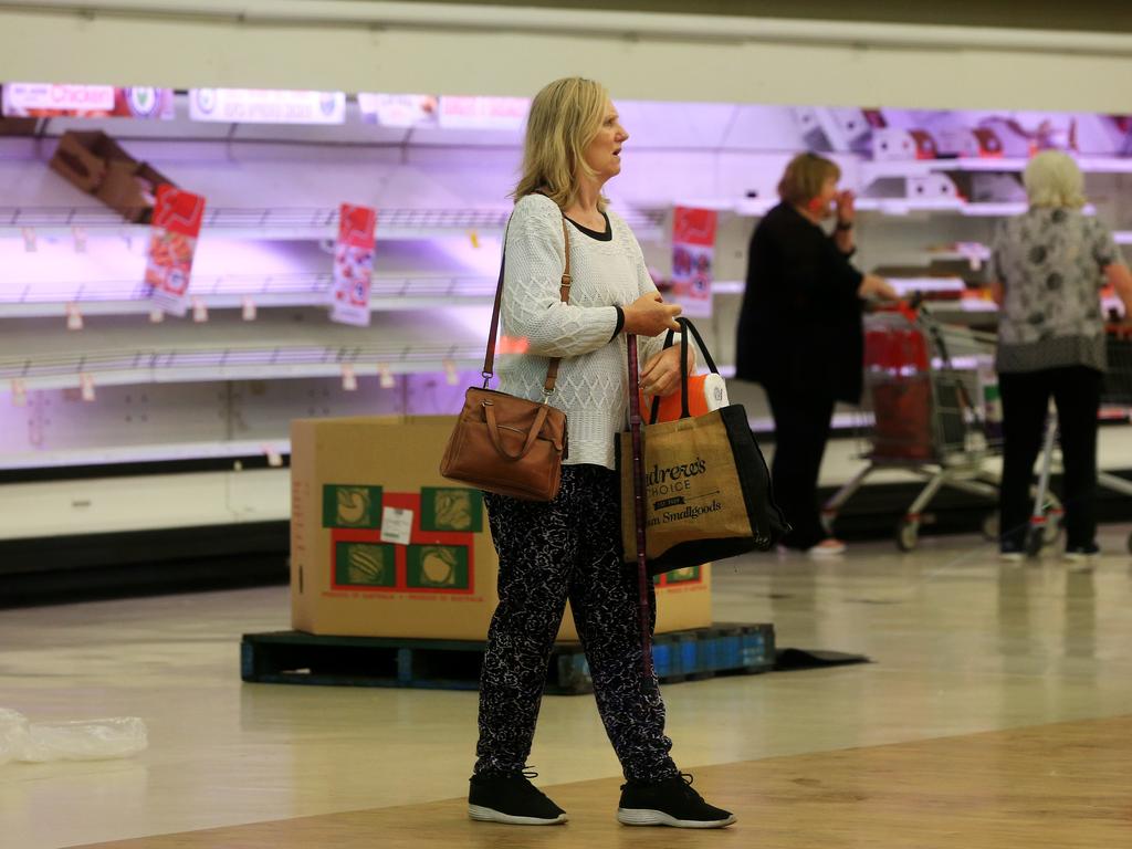 A shopper at Coles in Coburg this morning, which opened early for customers who are elderly or disadvantaged. Picture: Mark Stewart