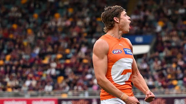 BRISBANE, AUSTRALIA - AUGUST 10: Aaron Cadman of the Giants celebrates kicking a goal during the round 22 AFL match between Brisbane Lions and Greater Western Sydney Giants at The Gabba, on August 10, 2024, in Brisbane, Australia. (Photo by Albert Perez/AFL Photos via Getty Images)