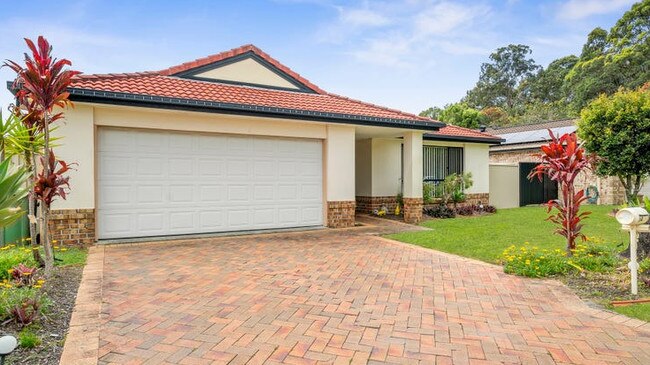 This four-bedroom house at 14 Neeson Place, Currumbin Waters, is on the market for $980,000.