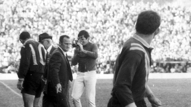 JUNE 6, 1970: Coach Arthur Summons yells instructions to Col Weiss (R) as takes field for injured Ron Lynch (10) during second test of Austrlaia v Great Britain series in Brisbane, 06/06/70. Pic News Limited. Historical Rugby League