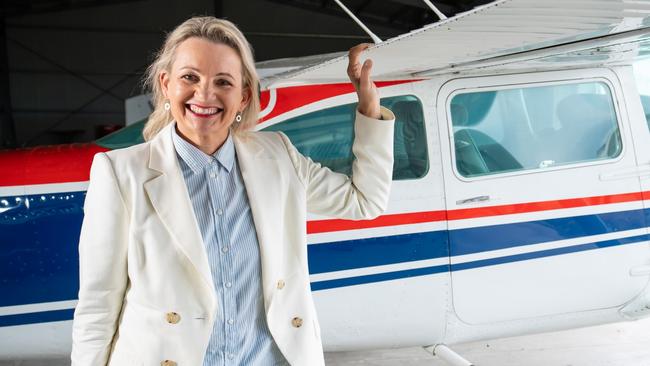 MP Sussan Ley poses with the first plane she flew at Albury Airport. Picture: Simon Dallinger